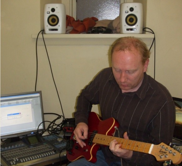 Tommie Mackay with guitar